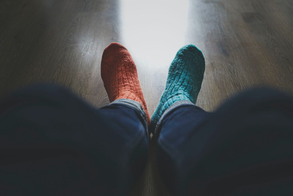 socks, walking socks, odd socks, clothing, apparel, shoe, footwear, pants, people images & pictures, human, sock, floor, sneaker, free stock photos